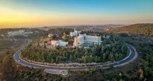 an aerial view of a building and a road at Yearim Hotel in Maale Hachamisha
