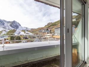 a window with a view of a mountain at Studio 5 pers. proche pistes, balcon, casier à skis, non-fumeur - FR-1-404-81 in La Mongie +4 photos