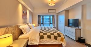 Qian's House Wanyu All-Suite Holiday Apartment電視和／或娛樂中心