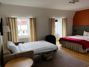Postel nebo postele na pokoji v ubytování Hotel Bishops Arms Strängnäs