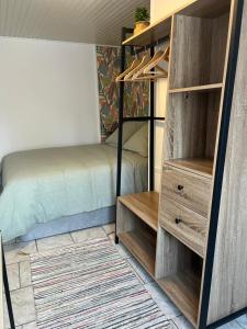 a bedroom with a bed and a bunk bed at Maison de ville rénovée in Senonches