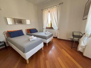 Posteľ alebo postele v izbe v ubytovaní Casa Vacanze Magnolia