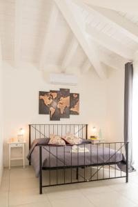 Posteľ alebo postele v izbe v ubytovaní Residenza del Barone Luxury House - Pula, Sardegna