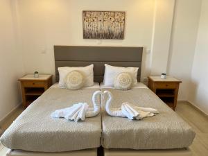 Postel nebo postele na pokoji v ubytování Yannakis Apartments