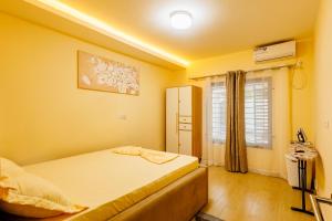 Ένα ή περισσότερα κρεβάτια σε δωμάτιο στο Maison Blanche