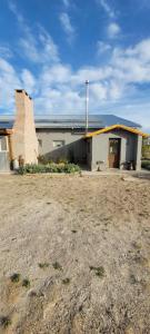a building with a roof on top of it at Finca san benito in Puerto Madryn +17 photos
