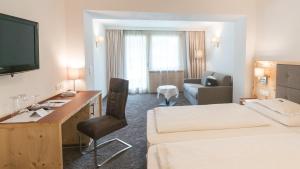 Postel nebo postele na pokoji v ubytování Wellnesshotel Mein Almhof Superior