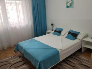 Ένα ή περισσότερα κρεβάτια σε δωμάτιο στο Apartament Azur