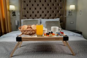 Postel nebo postele na pokoji v ubytování Hotel Melthon Class