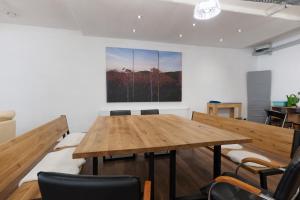 a dining room with a wooden table and chairs at Ferienwohnung Möckmühl in Möckmühl