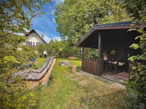 a wooden pavilion in a yard next to a house at Kleiner Urlaub in Beuron