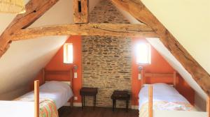 La Vieille Foulonnière : Chambres d'hôtes & Permaculture客房内的一张或多张床位