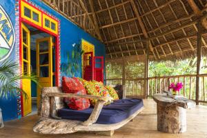 a room with a bed in a house at Kaya Imani in Msambweni
