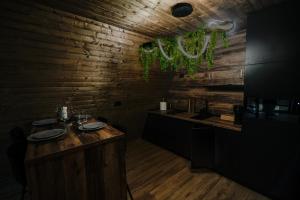 a dining room with a table with plates on it at A-Wine Villas in Novaci +23 photos