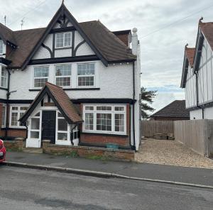 a house on the side of a street at Lighthouse Lodge in Harwich