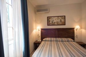 A bed or beds in a room at Hotel Villa Rodriguez