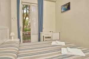 A bed or beds in a room at Hotel Villa Rodriguez