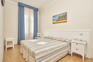 A bed or beds in a room at Hotel Villa Rodriguez