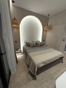 a bedroom with a large bed in a room at erasmia luxury suite in Georgioupolis