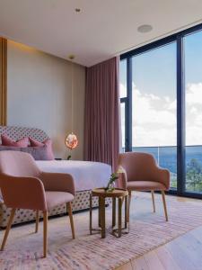 Ένα ή περισσότερα κρεβάτια σε δωμάτιο στο The Pinnacle Kigali +62 φωτογραφίες