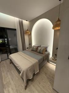a bedroom with a large bed in a room at erasmia luxury suite in Georgioupolis