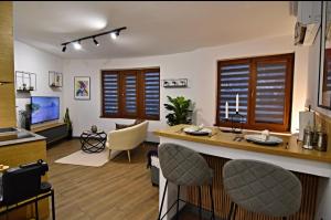 a kitchen and living room with a table and chairs at Oblivion in Velingrad