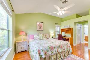 a bedroom with a bed and a ceiling fan at Pet-Friendly Home with Golf Cart in The Villages! in Lady Lake +21 photos