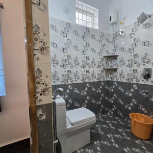 a bathroom with a toilet and a shower at Padmini's home stay New apartment 2bhk in Tirupati