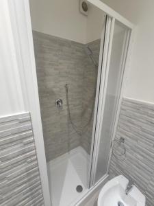 a bathroom with a shower and a sink at Central apartment with charm for 1 or 2 people - Casa Vacanze Luna in Lascari +12 photos