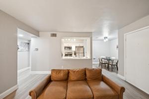a living room with a couch and a table at The Chandler 412 I Spacious 1 Bed 1 Bath in Grand Prairie