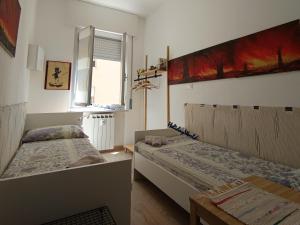 En eller flere senge i et værelse på Casa le Fontane by Holiday World