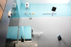 a bathroom with a mirror at H2cottage in Wodapatti +14 photos