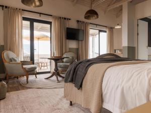 Postel nebo postele na pokoji v ubytování Surfside Swakopmund