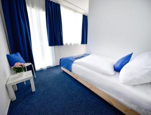 Postel nebo postele na pokoji v ubytování Zama Hotel