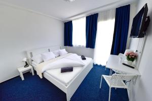 TV a/nebo společenská místnost v ubytování Zama Hotel
