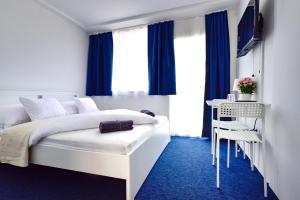 Postel nebo postele na pokoji v ubytování Zama Hotel