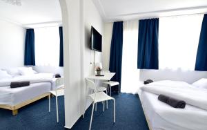 Postel nebo postele na pokoji v ubytování Zama Hotel