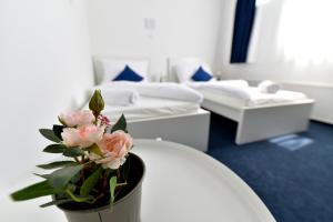 Postel nebo postele na pokoji v ubytování Zama Hotel