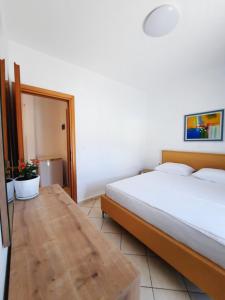Amarildo Hotel客房内的一张或多张床位