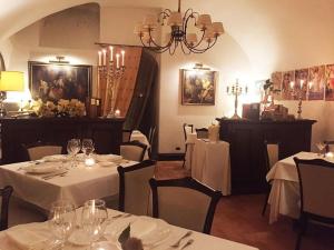 a restaurant with two tables with white tableclothsurrencyangering at La Corte dei Prefetti di Vico Bellavista Relax in Ronciglione