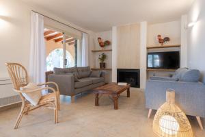 a living room with a couch and a table at Paz y Mar, Santa Ponsa in Santa Ponsa