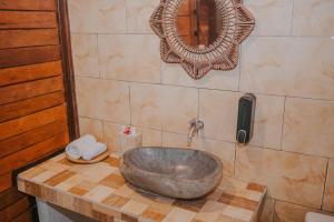 a bathroom with a large metal sink on a counter at Kubu Semer Badung in Nusa Lembongan +20 photos