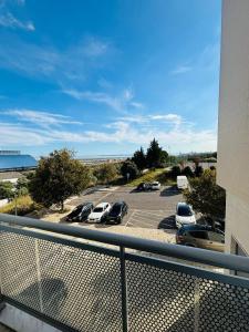 a view from a balcony of a parking lot at Vista Gama in Santa Iria da Azóia