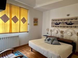A bed or beds in a room at B&B Su Biancu - Sardinian Experience