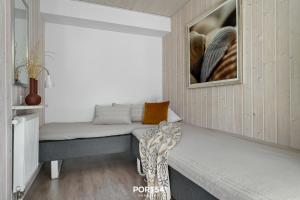 En eller flere senge i et værelse på Ferienhaus Lagunenblick 42 Marina Wendtorf