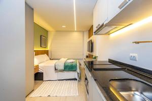 Camera piccola con letto e lavandino di Requinte e Conforto no All Batel - BAT0924 a Curitiba