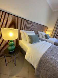 A bed or beds in a room at Villa Victoria With Heated Pool