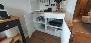 a small kitchen with a counter and a shelf at Gala Lenassi in Kamnik +18 photos