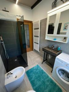 a bathroom with a sink and a toilet and a sink at La Reggia di Famiglia in Venaria Reale +25 photos