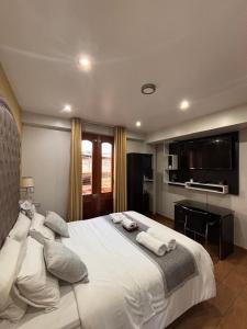 Postel nebo postele na pokoji v ubytování Hotel Melthon Class